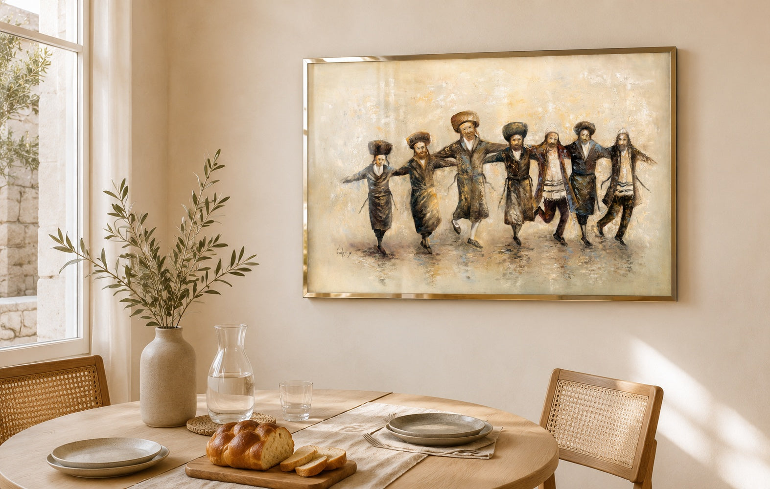 Sepia painting of dancing Hasidic Jewish men in slim brass frame above wooden dining table with challah bread.