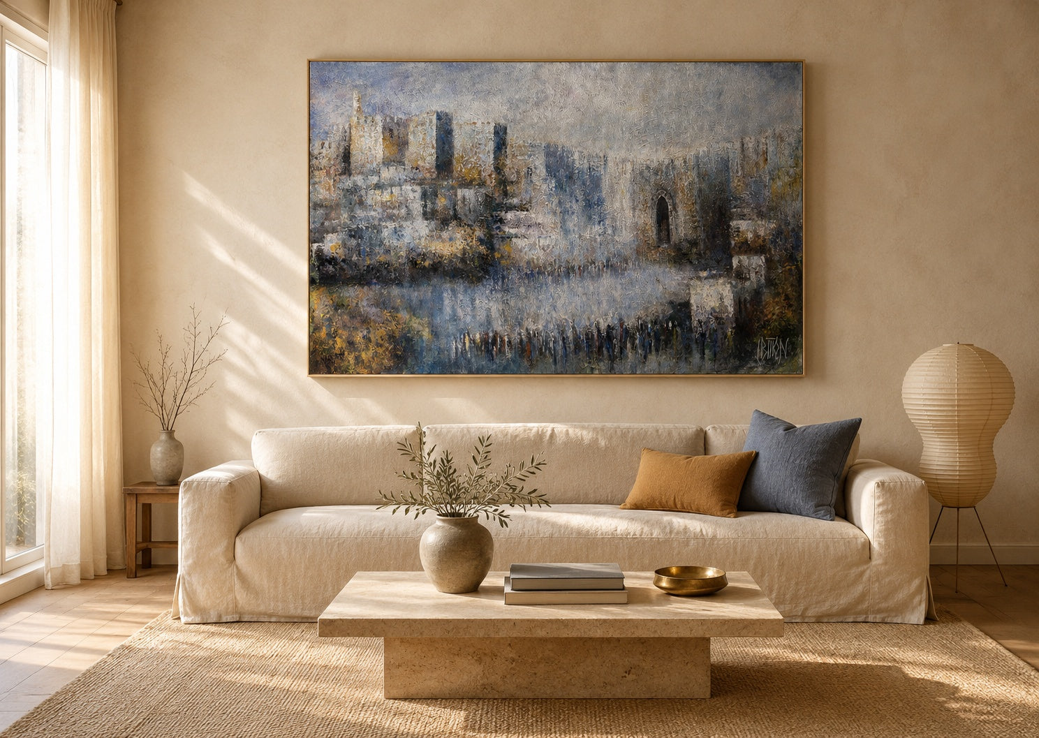 Large abstract Jerusalem Old City painting in blue and gold tones above a cream linen sofa in a warm neutral living room.